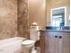 Well-lit bathroom with tile shower, updated vanity, and granite countertop at 107 Bella Casa Way, Clayton, NC 27527