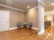 Spacious bonus room features hardwood floors, neutral walls, and classic white trim at 107 Bella Casa Way, Clayton, NC 27527