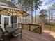 Outdoor deck area with table and chairs, perfect for relaxing and enjoying the surrounding scenery at 107 Bella Casa Way, Clayton, NC 27527
