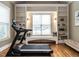 This exercise area has built-in shelving and a bench for relaxing after a workout at 107 Bella Casa Way, Clayton, NC 27527