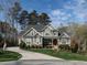 Beautiful two-story home featuring a well-manicured front yard and a curved driveway at 107 Bella Casa Way, Clayton, NC 27527