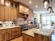 Well-appointed kitchen features custom cabinets, granite counters, and stainless steel appliances at 107 Bella Casa Way, Clayton, NC 27527