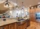 Open kitchen with stainless steel appliances, a large island, and access to other living spaces at 107 Bella Casa Way, Clayton, NC 27527