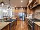 Spacious kitchen featuring custom cabinets, stainless steel appliances, and granite countertops at 107 Bella Casa Way, Clayton, NC 27527