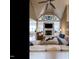Open living space with vaulted ceiling, fireplace, sectional sofa, and open floorplan at 107 Bella Casa Way, Clayton, NC 27527