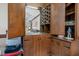 A classic wooden bar area with glassware, shelving, and an inset sink at 108 Birdie Ct, Rocky Mount, NC 27804