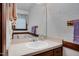 Cozy bathroom with a vanity sink and decorative wall paper at 108 Birdie Ct, Rocky Mount, NC 27804