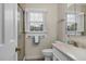 Bright bathroom featuring a glass-enclosed shower, open window, toilet, and vanity at 108 Birdie Ct, Rocky Mount, NC 27804