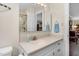 Bathroom with a vanity with an integrated sink, toilet, mirror, and glass-enclosed shower at 108 Birdie Ct, Rocky Mount, NC 27804