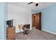Functional bedroom with a desk, a chair, and a retro television on a wooden stand at 108 Birdie Ct, Rocky Mount, NC 27804