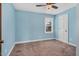 Bedroom with carpet and a large window at 108 Birdie Ct, Rocky Mount, NC 27804
