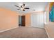 Bedroom with carpet, ceiling fan, and a double closet at 108 Birdie Ct, Rocky Mount, NC 27804