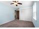 This bedroom has carpet floors, ceiling fan, and light blue walls at 108 Birdie Ct, Rocky Mount, NC 27804