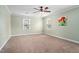 Bedroom with two windows and carpeted floor at 108 Birdie Ct, Rocky Mount, NC 27804