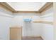Walk-in closet with built-in shelving and clothes rack at 108 Birdie Ct, Rocky Mount, NC 27804