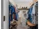 Functional walk-in closet with ample hanging space and storage shelves, providing organization at 108 Birdie Ct, Rocky Mount, NC 27804