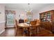 An inviting dining room features a wooden table and chairs with decorative hardwood flooring at 108 Birdie Ct, Rocky Mount, NC 27804