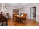 An inviting dining room features a wooden table and chairs with decorative hardwood flooring at 108 Birdie Ct, Rocky Mount, NC 27804