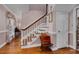 Traditional foyer with hardwood floors, staircase, and classic decor at 108 Birdie Ct, Rocky Mount, NC 27804