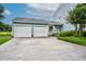 Two-car garage with driveway and well-maintained landscaping at 108 Birdie Ct, Rocky Mount, NC 27804