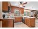 Traditional style kitchen featuring wood cabinetry, stainless steel appliances, and a ceiling fan at 108 Birdie Ct, Rocky Mount, NC 27804