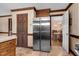 Spacious kitchen featuring a refrigerator and access to another room at 108 Birdie Ct, Rocky Mount, NC 27804