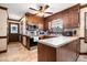 Bright kitchen featuring wood cabinets, an island, and stainless steel appliances at 108 Birdie Ct, Rocky Mount, NC 27804