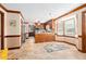 Open kitchen featuring wood cabinets, tile floors, stainless appliances, and a breakfast nook at 108 Birdie Ct, Rocky Mount, NC 27804