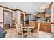 Charming kitchen with a dining table, wood cabinets, and stainless steel appliances at 108 Birdie Ct, Rocky Mount, NC 27804
