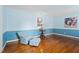 Comfortable seating arrangement in a charming living room with hardwood floors and light blue walls at 108 Birdie Ct, Rocky Mount, NC 27804