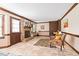 Cozy living room with brick fireplace, neutral walls, and tile floors at 108 Birdie Ct, Rocky Mount, NC 27804