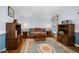 Cozy living room featuring a traditional decor, blue walls, and hardwood flooring at 108 Birdie Ct, Rocky Mount, NC 27804