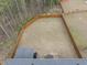 Aerial view of a spacious, fenced backyard with ample green space, mature trees and a shed at 111 Kim Bark Path, Garner, NC 27529