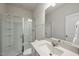 Clean bathroom design with glass shower, bright mirror and sink at 111 Kim Bark Path, Garner, NC 27529