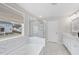 Clean bright bathroom with natural light, standalone tub, and glass shower at 111 Kim Bark Path, Garner, NC 27529
