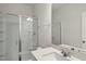 Modern bathroom with a spacious glass shower and bright vanity mirror at 111 Kim Bark Path, Garner, NC 27529