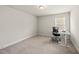 Bright bedroom featuring neutral walls, plush carpet, natural light, and modern desk space at 111 Kim Bark Path, Garner, NC 27529