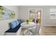 Breakfast nook with a built-in banquette and access to a screened porch for outdoor dining at 111 Kim Bark Path, Garner, NC 27529