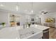 Open concept kitchen with stainless appliances and an island sink overlooking the living area at 111 Kim Bark Path, Garner, NC 27529