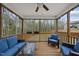 Inviting screened porch with wood floors, ceiling fan, and comfortable seating for relaxing outdoors at 111 Kim Bark Path, Garner, NC 27529
