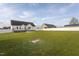 Large backyard featuring lush green grass and a white vinyl privacy fence at 114 Hudson Dr, Princeton, NC 27569