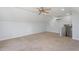 Spacious bonus room with carpet flooring, ample natural light, and ceiling fan at 114 Hudson Dr, Princeton, NC 27569