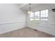 Open dining area featuring natural light and tile flooring at 114 Hudson Dr, Princeton, NC 27569