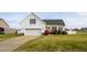 Charming single Gathering home with a two car garage, attractive landscaping, and a well maintained lawn at 114 Hudson Dr, Princeton, NC 27569