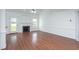 Spacious living room with hardwood floors, fireplace, vaulted ceilings, and lots of natural light at 114 Hudson Dr, Princeton, NC 27569
