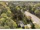 Stunning aerial view of a home nestled among lush trees, providing privacy and a serene setting at 11404 Leesville Rd, Raleigh, NC 27613