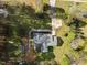 Overhead view of a well-maintained home, with landscaping, shed, and driveway at 11404 Leesville Rd, Raleigh, NC 27613