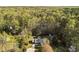 Home nestled among lush trees with a long driveway, and a convenient storage shed at 11404 Leesville Rd, Raleigh, NC 27613