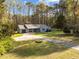 Single story home features a two-car garage and inviting front porch at 11404 Leesville Rd, Raleigh, NC 27613