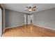 Large bedroom with hardwood floors, a ceiling fan and access to a bathroom and other rooms at 11404 Leesville Rd, Raleigh, NC 27613